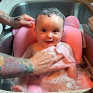 Valentina joined the competition — help win amazing prizes! baby, bath, sink, soap, bubbles, pink_cushion, tattooed_hands, water, kitchen, cleaning, child, smile, cute, foam, wet_hair, infant, happy, person, toddler, parenting