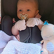 Freya joined the competition — help win amazing prizes! baby, pacifier, mittens, car_seat, blanket, plush_toy, dinosaur_toy, infant, child, cute, soft, pink, comfort, portrait, newborn, safe, indoor, young_child, seated, adorable