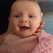 Freya joined the competition — help win amazing prizes! baby, blanket, child, closeup, clothing, cute, expression, eyes, face, hand, happy, head, indoors, infant, person, pink, portrait, skin, smile, soft