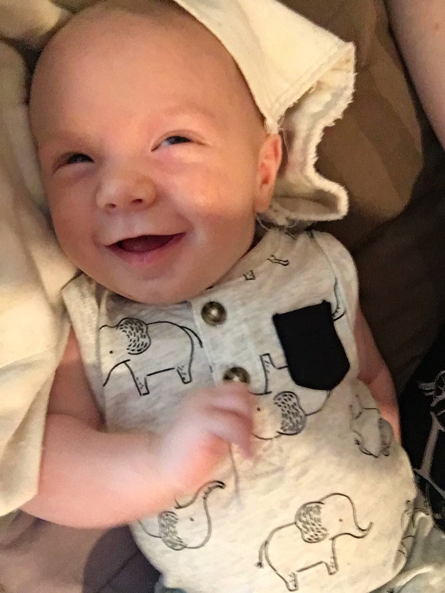 Jaxston is registered to the contest to win money with this photo: arm, baby, baby_products, cheek, child, chin, cool, face, facial_expression, finger, forehead, head, human, lip, mouth, nose, person, product, skin, smile