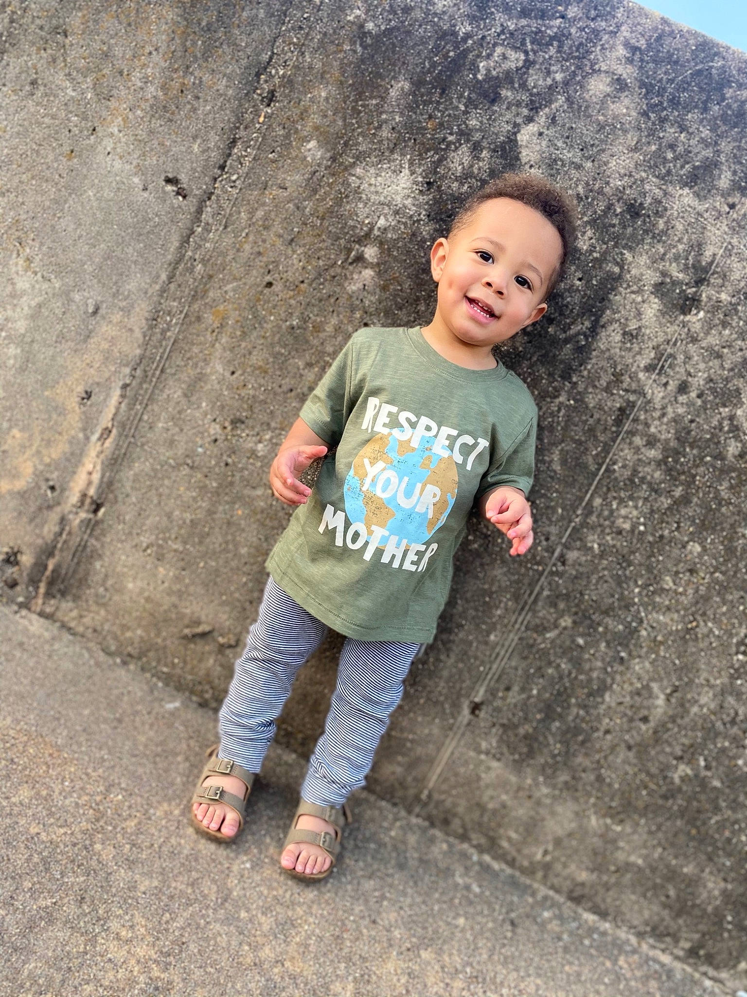 Kysen is registered to the contest to win money with this photo: asphalt, child, concrete, fun, geology, happy, joy, landscape, leisure, person, public_space, road_surface, rock, sand, sandal, skin, sleeve, soil, t_shirt, toddler