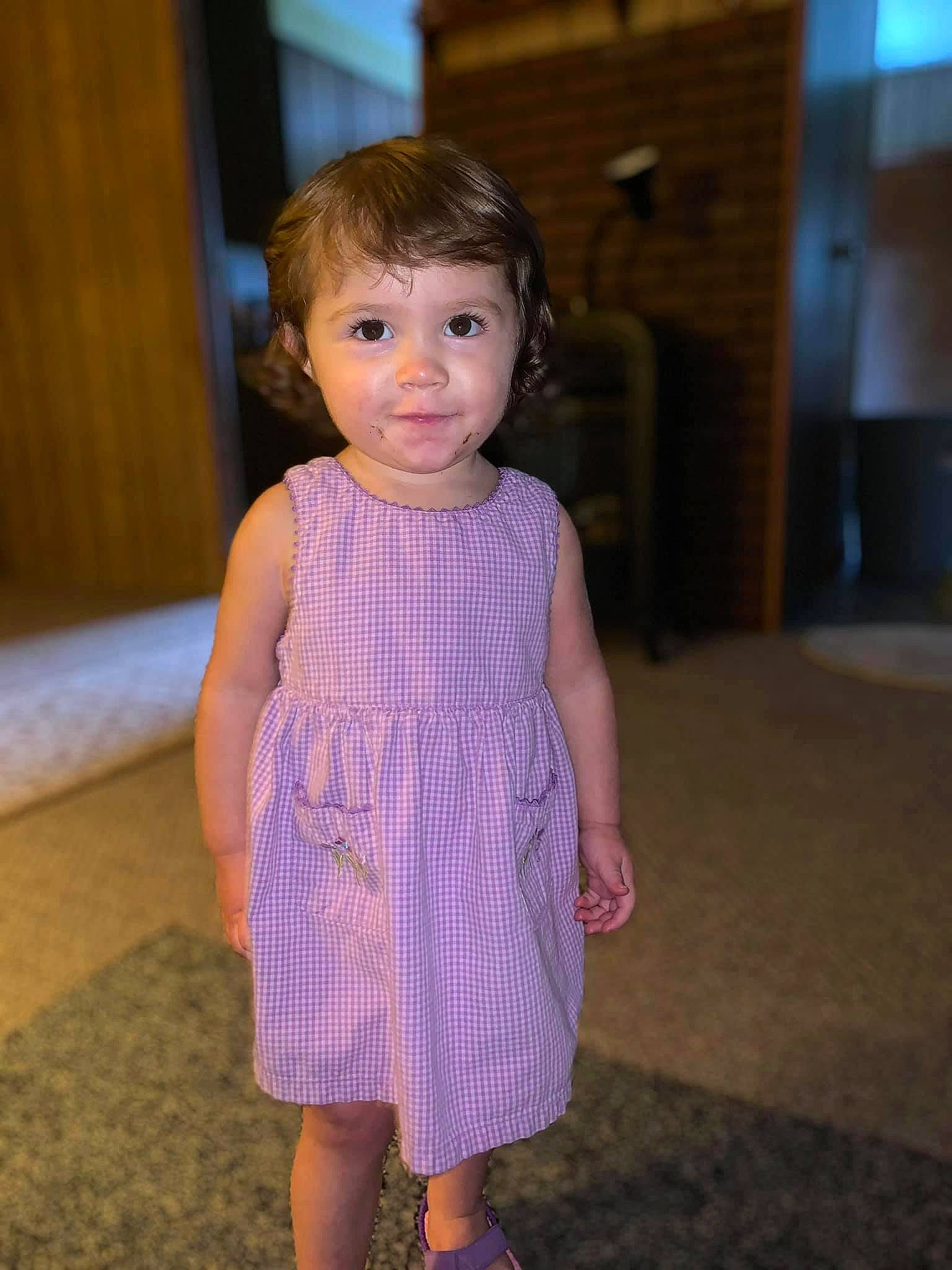 Caitlyn is registered to the contest to win money with this photo: baby_toddler_clothing, cheek, child, day_dress, dress, electric_blue, face, fashion_design, flooring, formal_wear, fun, hair, iris, one_piece_garment, pattern, person, purple, shoulder, skin, sleeve