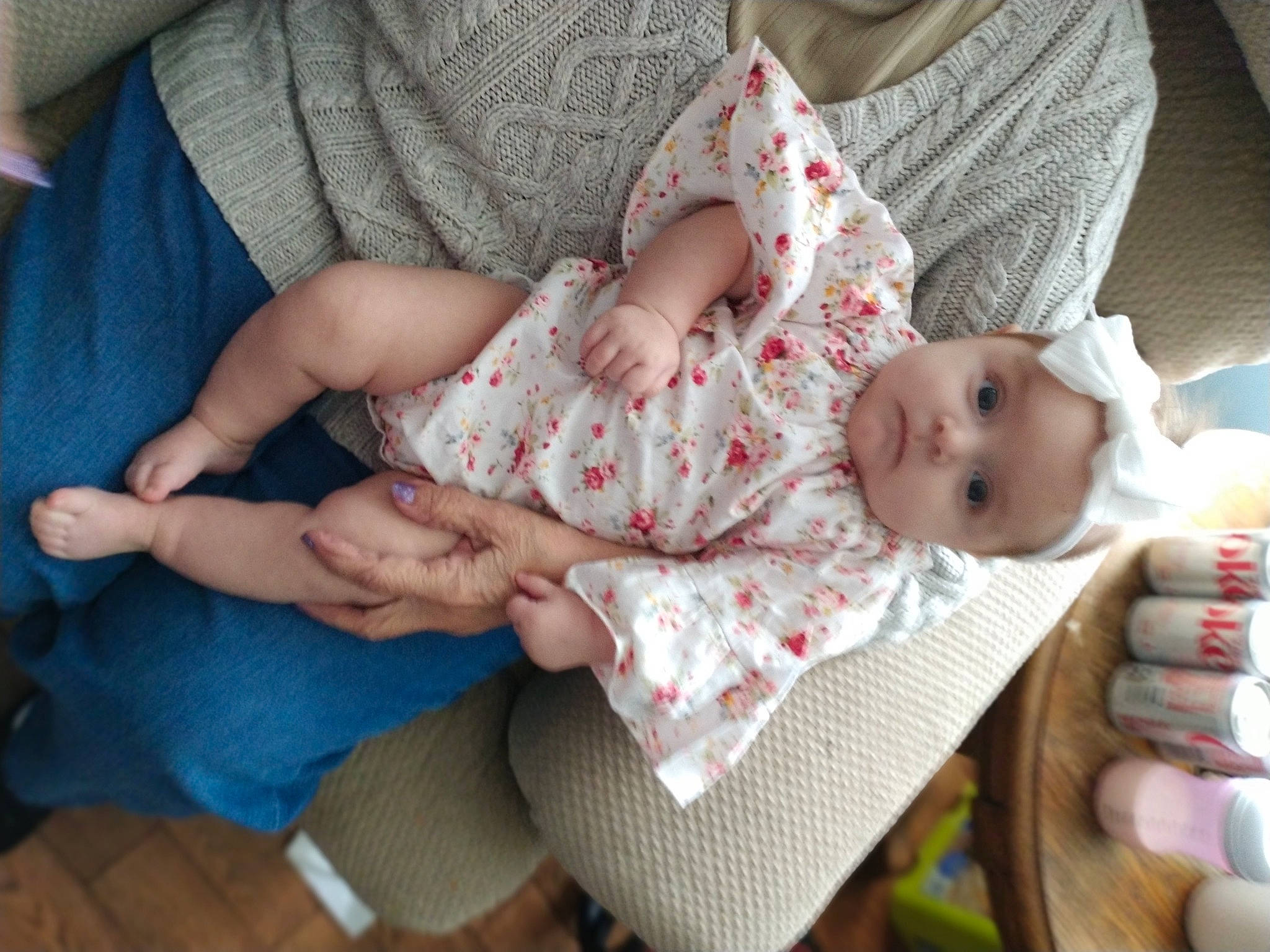 Nadine is registered to the contest to win money with this photo: baby, baby_products, baby_toddler_clothing, cheek, child, comfort, finger, gesture, grass, hand, lap, nail, pattern, person, sitting, skin, sleeve, sock, thigh, thumb