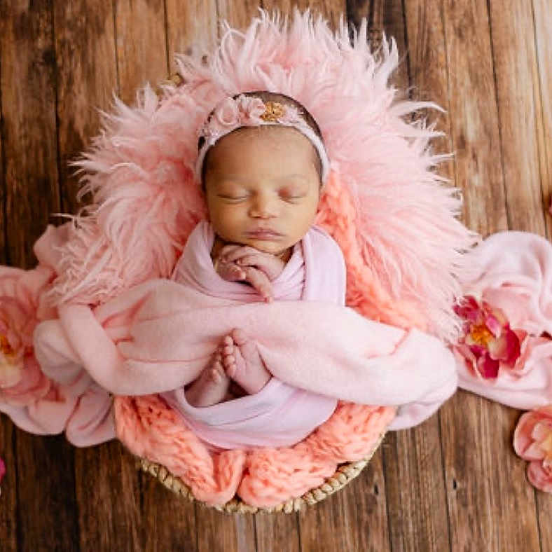 Kalayla Tapia is registered to the contest to win money with this photo: baby, basket, blanket, child, cozy, cute, decorative, flower, headband, infant, newborn, peaceful, pink, portrait, resting, sleeping, soft, toddler, wooden_floor, wrapped