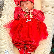 Eliana joined the competition — help win amazing prizes! baby, sleeping, red_outfit, headband, pacifier, baby_lounger, soft_fabric, reindeer_design, tutu_skirt, footed_pajamas, polka_dots, cute, infant, cozy, indoors, resting, child, holiday_theme, newborn, peaceful