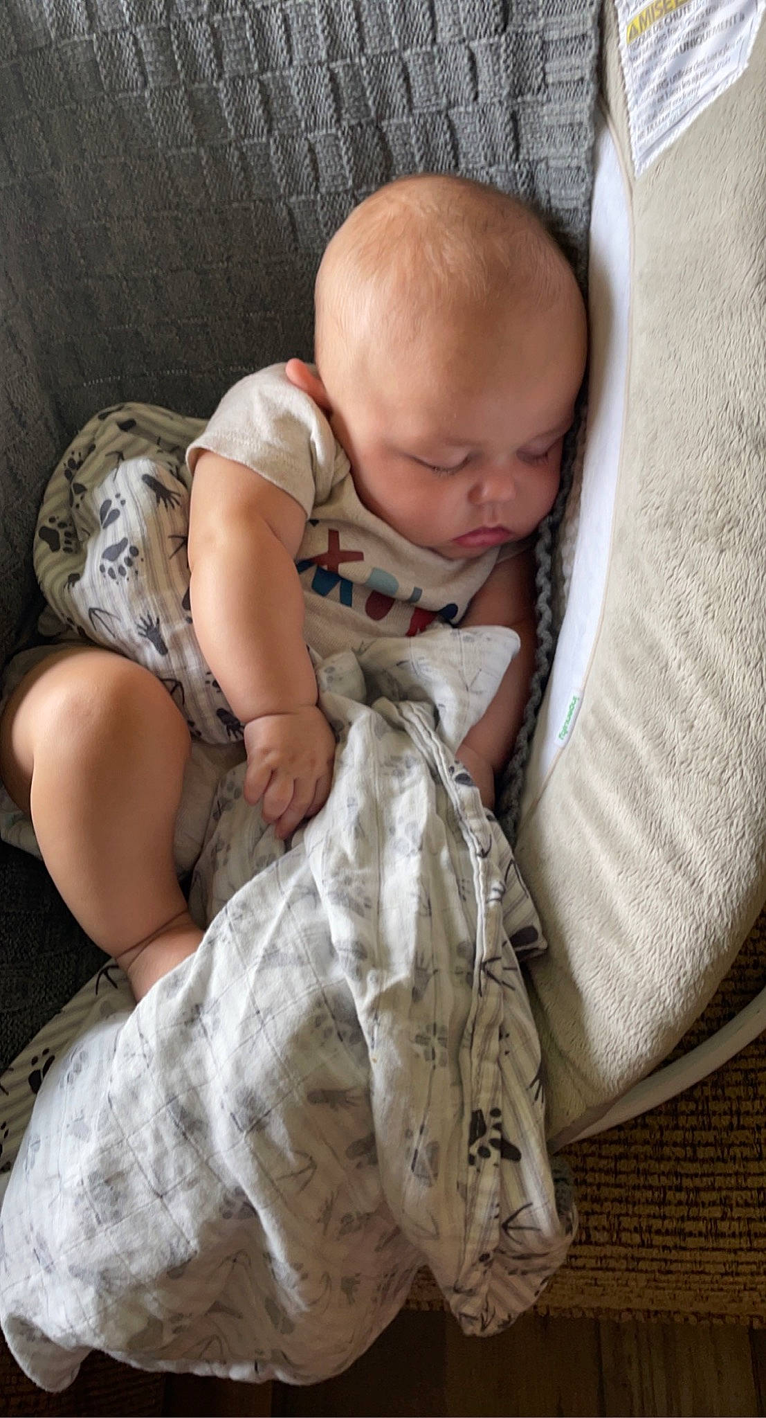 Jessie joined the competition — help win amazing prizes! baby, baby_products, baby_toddler_clothing, bedding, bedtime, child, comfort, couch, flooring, grass, human_leg, linens, nap, person, room, sitting, t_shirt, textile, thigh, toddler