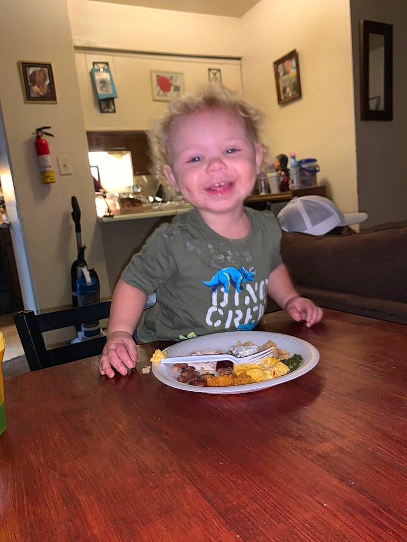 Andre joined the competition — help win amazing prizes! chair, child, dishware, floor, flooring, food, fun, happy, hardwood, joy, person, picture_frame, plate, serveware, smile, t_shirt, table, tableware, toddler, varnish