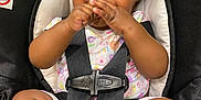 Ava joined the competition — help win amazing prizes! baby, child, car_seat, safety_harness, infant, cute, smiling, hands, feet, clothing, patterned_outfit, black_straps, indoors, seat, young_child, portrait, happy, skin, face, close_up