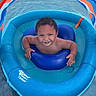 toddler, child, inflatable, pool, water, float, canopy, swimming, smiling, happy, summer, outdoor, baby, fun, play, blue, orange, skin, face, person
