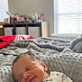newborn, baby, smiling, blanket, bed, indoors, cozy, sleeping, soft, pacifier, window, light, face, person, infant, clothing, quiet, peaceful, resting, nursery