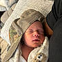 baby, newborn, sleeping, blanket, hat, camo, mesh, person, arm, cozy, indoor, couch, pillow, clothing, soft, rest, peaceful, portrait, closeup, infant