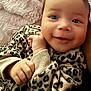 baby, blanket, bodypart, clothing, cushion, face, finger, hand, happy, head, homedecor, laughing, mouth, newborn, person, photography, portrait, quilt, smile, teeth