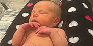 Gwendolyn joined the competition — help win amazing prizes! newborn, baby, sleeping, diaper, blanket, heart_pattern, infant, person, hand, foot, table, baby_bottle_nipple, snack, indoor, flooring, legs, skin, relaxing, comfort, cozy