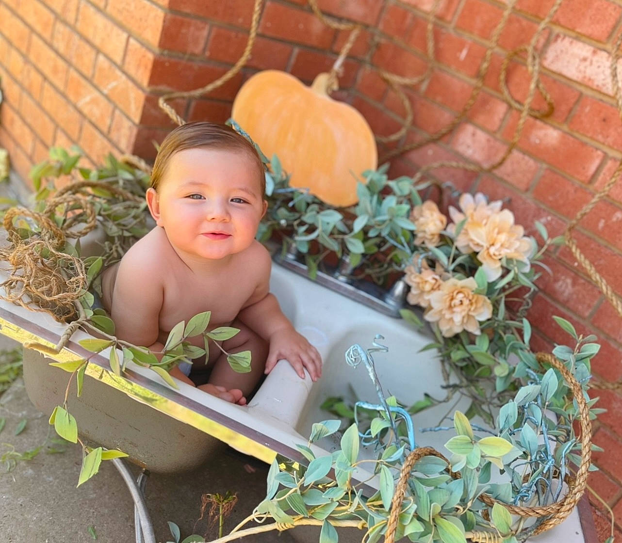 Kian joined the competition — help win amazing prizes! baby, baby_products, baby_toddler_clothing, brick, brickwork, child, flower, flower_arranging, flowerpot, garden, grass, happy, leisure, person, petal, plant, sitting, smile, toddler, toy