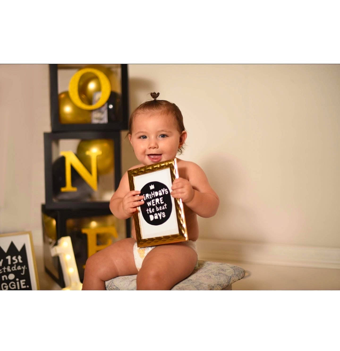 Kian is registered to the contest to win money with this photo: baby, baby_toddler_clothing, chest, elbow, flash_photography, font, foot, happy, human_leg, knee, person, portrait_photography, room, selfie, shorts, sitting, sleeve, t_shirt, thigh, toddler