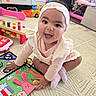 Olivia joined the competition — help win amazing prizes! baby, child, smiling, play_mat, headband, toys, indoor, colorful, activity_book, pink, cute, frilly_clothing, happy, sitting, floor, playtime, infant, expression, hand, engaged