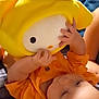 baby, bed, blanket, child, childhood, comfort, cozy, cute, face, hands, indoors, infant, lying_down, orange_clothing, plush_toy, sleepy, soft, soft_toy, toy, yellow