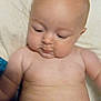 Saranae is registered to the contest to win money with this photo: baby, bare_chest, blanket, child, chubby, cute, diaper, expression, face, head, indoor, infant, newborn, person, portrait, rolls, sitting, skin, soft, young