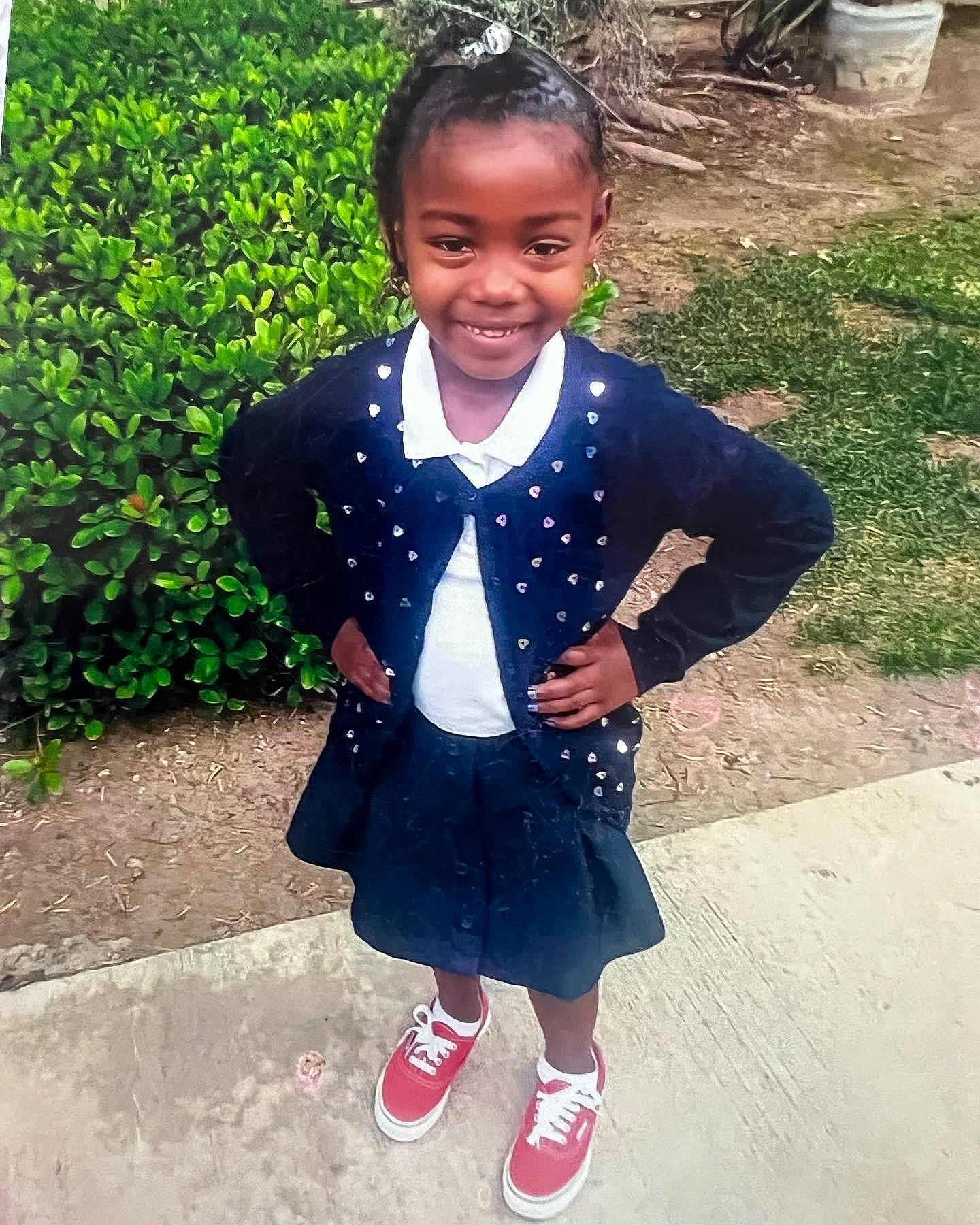 Winter is registered to the contest to win money with this photo: arm, child, electric_blue, facial_expression, formal_wear, grass, hair, hairstyle, happy, head, jewellery, joy, outerwear, pattern, person, plant, school_uniform, shoe, sleeve, smile