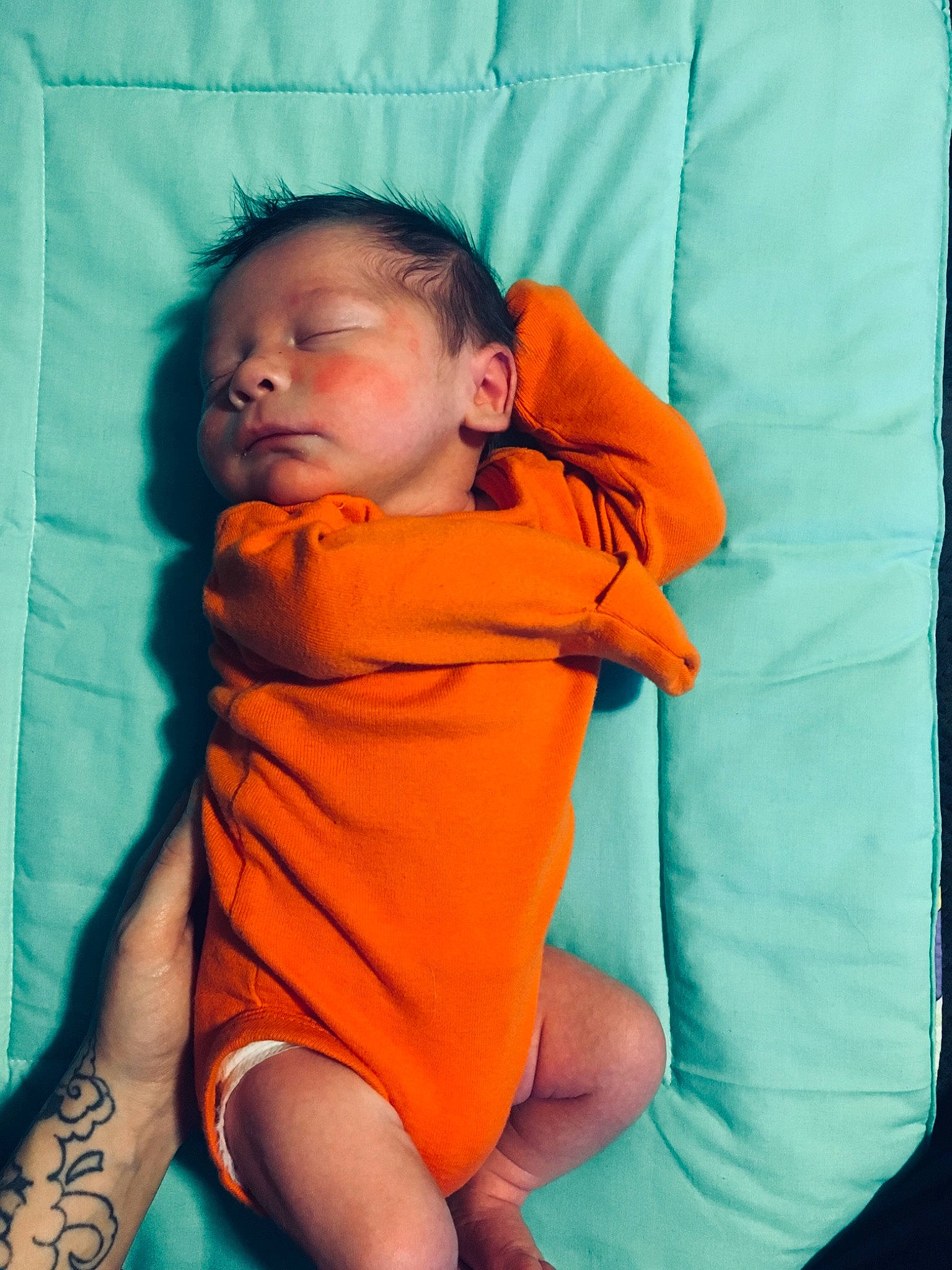 Giovani is registered to the contest to win money with this photo: baby, child, headwear, linens, orange, person, sleep, toddler