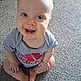 Matteo joined the competition — help win amazing prizes! baby, child, smiling, blue_eyes, sitting, carpet, tshirt, logo, happy, cute, indoor, infant, portrait, one_person, casual_clothing, barefoot, looking_up, light_skin, short_hair, playful