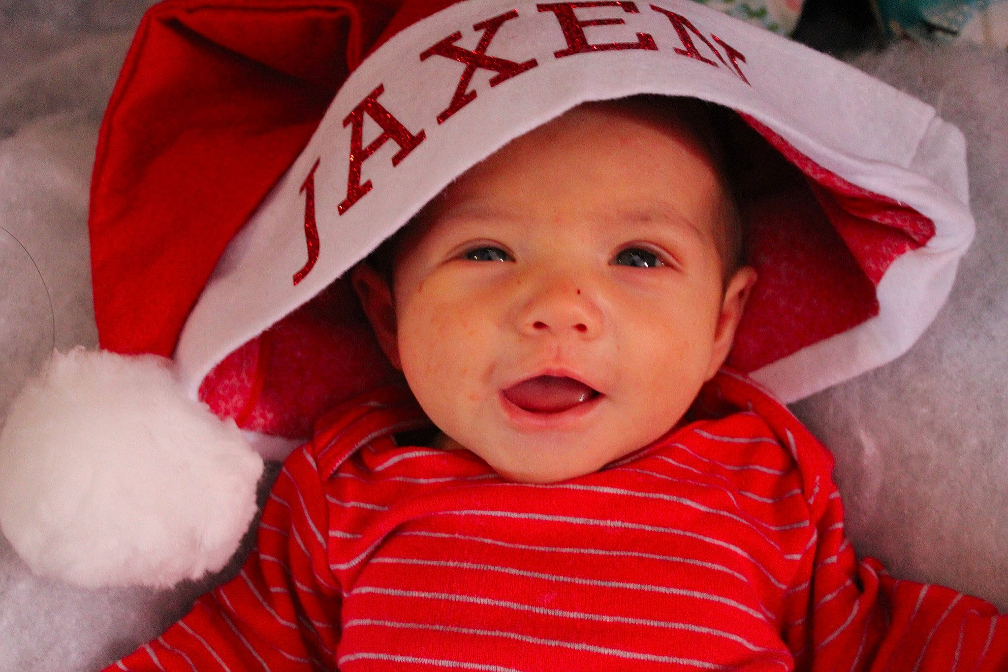 Jaxen is registered to the contest to win money with this photo: baby, baby_toddler_clothing, bonnet, carmine, cheek, child, costume_accessory, flesh, headwear, lip, mouth, nose, person, portrait_photography, red, skin, toddler