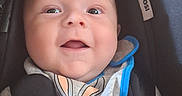 Zyon is registered to the contest to win money with this photo: baby, car, car_interior, carseat, clothing, coat, cushion, face, happy, hat, head, homedecor, jacket, newborn, person, photography, portrait, smile, transportation, vehicle