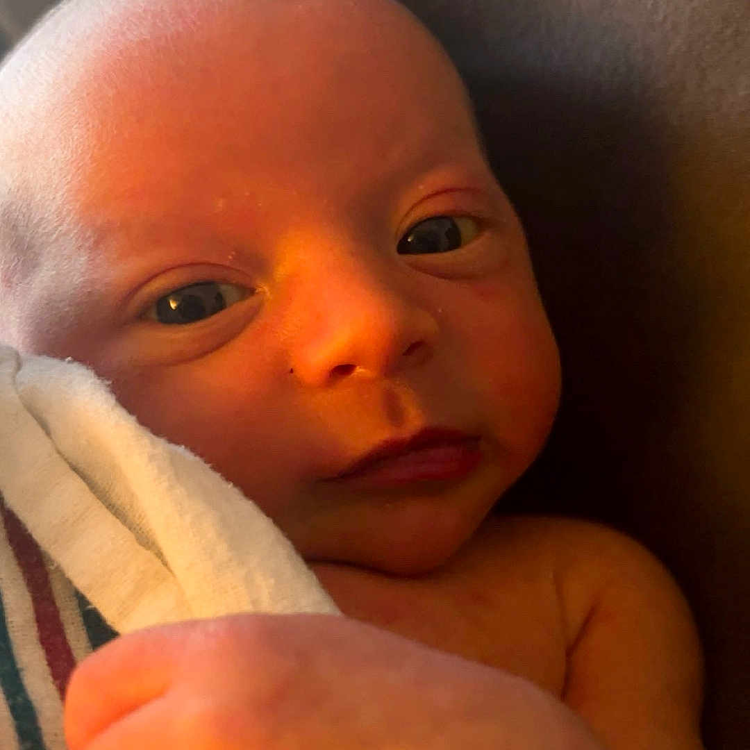 Luxton joined the competition — help win amazing prizes! baby, blanket, child, closeup, cute, face, hand, indoors, infant, newborn, newborn_baby, peaceful, portrait, resting, skin, sleepy, soft, toddler, warm_light, wrapped