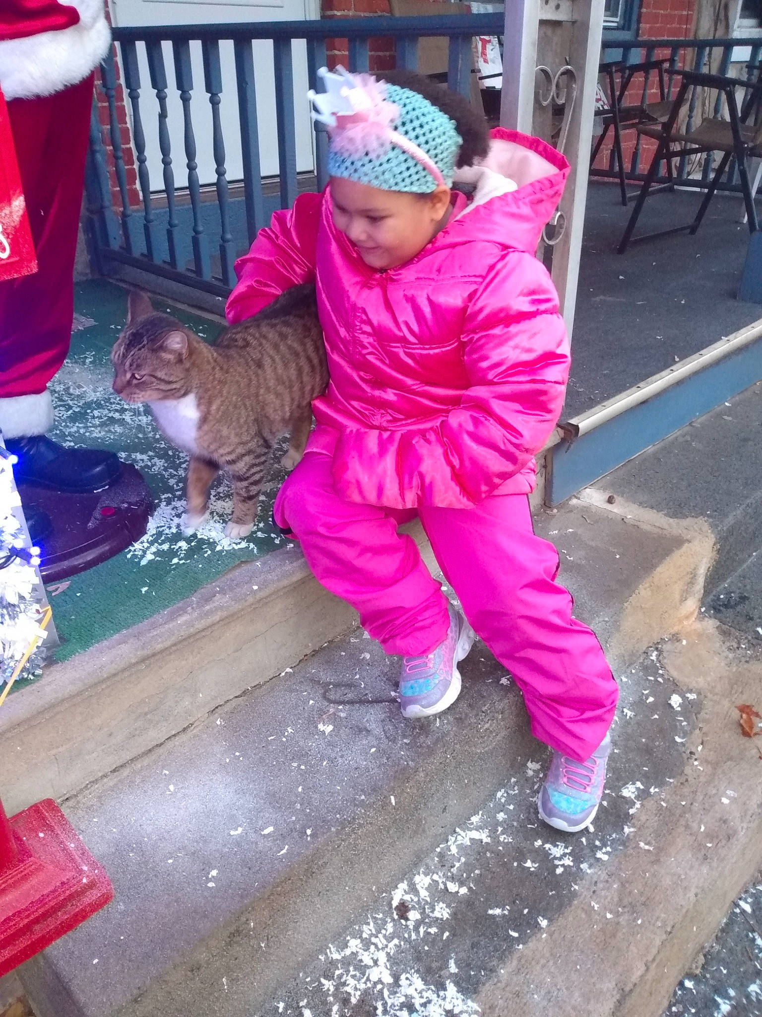 Janiyah joined the competition — help win amazing prizes! asphalt, chair, child, felidae, fun, headwear, leisure, magenta, pedestrian, person, pink, red, road, road_surface, shoe, sidewalk, sneakers, street, temple, toddler