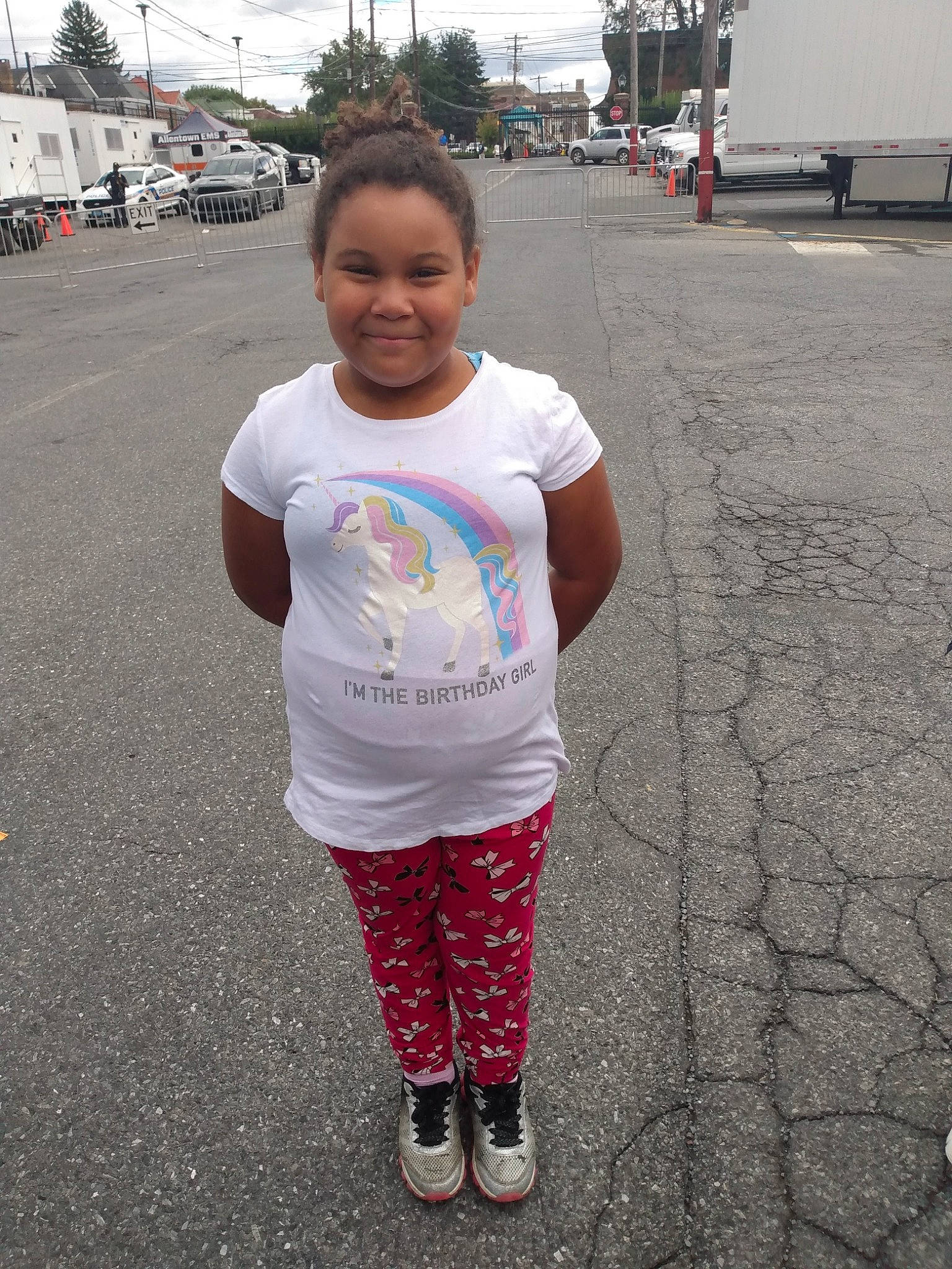 Shaniyah is registered to the contest to win money with this photo: asphalt, event, face, fun, happy, head, joy, leisure, magenta, mouth, pedestrian, person, pink, public_space, recreation, road_surface, sidewalk, sky, sleeve, smile