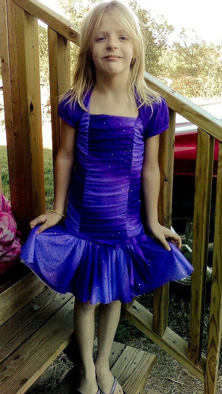 Meghan is registered to the contest to win money with this photo: ballet_tutu, blond, blue, child_model, clothing, cocktail_dress, costume, dress, electric_blue, fashion, long_hair, person, purple, smile, waist