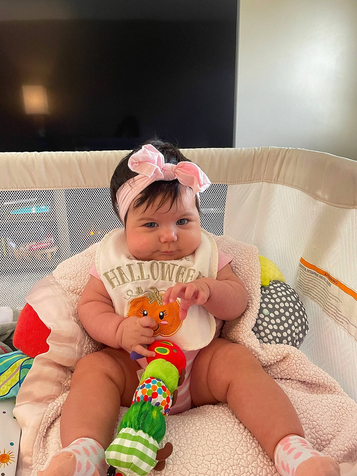 Madeleine joined the competition — help win amazing prizes! baby, baby_playing_with_toys, baby_toddler_clothing, child, comfort, fun, happy, headwear, human_body, human_leg, knee, lap, leg, leisure, person, skin, sock, stuffed_toy, textile, thigh