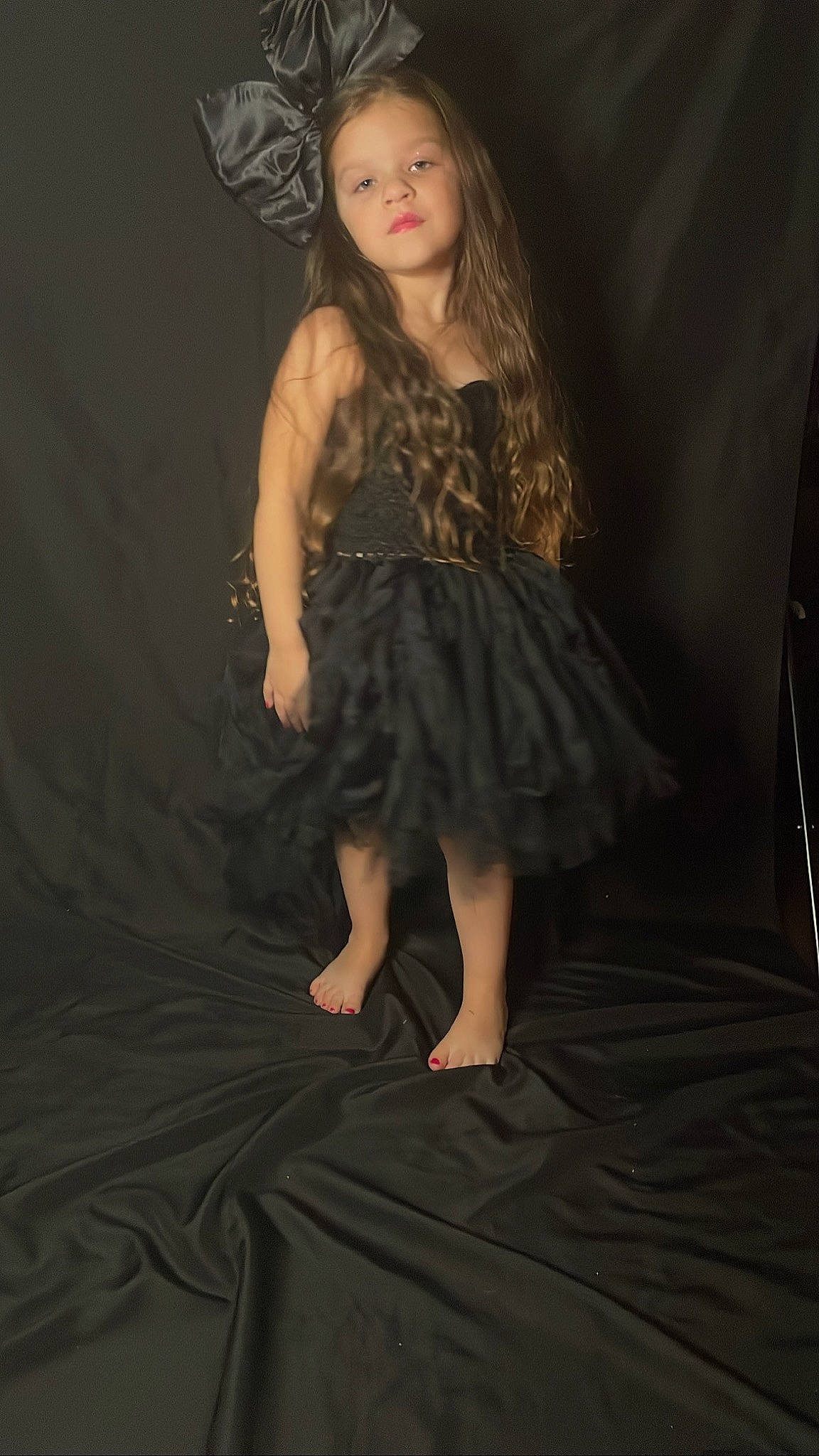 Meilani is registered to the contest to win money with this photo: brown_hair, cocktail_dress, darkness, day_dress, event, fashion_design, flash_photography, flooring, formal_wear, hair, human_leg, knee, long_hair, one_piece_garment, person, sleeve, thigh, toddler, trunk, waist