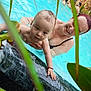 Luca Nicolae joined the competition — help win amazing prizes! baby, adult, swimming_pool, water, indoor, person, child, smiling, holding, plant, leaf, skin, people, swimwear, recreation, relaxation, fun, family, happy, leisure