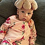 Alma a rejoint le concours — aidez-le/la à gagner de superbes lots ! baby, child, couch, cute, face, floral_pattern, headwear, indoors, infant, octopus, onesie, person, pillow, playful, plush_toy, relaxed, seated, smiling, soft_toy, tongue_out