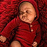 Kaizen joined the competition — help win amazing prizes! baby, child, closeup, cozy, cute, face, fluffy_background, hand, hooded_outfit, indoors, infant, knitwear, newborn, peaceful, portrait, red_clothing, resting, skin, sleeping, soft_texture