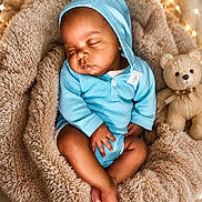 Kaizen joined the competition — help win amazing prizes! baby, sleeping, blue_hoodie, teddy_bear, cozy, blanket, soft, infant, cute, peaceful, indoor, portrait, child, nursery, warm_lighting, fairy_lights, relaxation, adorable, rest, comfort