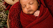 Kaizen is registered to the contest to win money with this photo: baby, basket, closeup, cozy, cute, decor, flowers, greenery, head_covering, indoor, infant, newborn, peaceful, portrait, red_blanket, sleeping, soft_texture, warm_colors, wooden_sign, wrapped