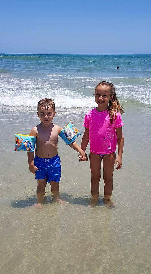 Emily joined the competition — help win amazing prizes! beach, body_of_water, child, coast, coastal_and_oceanic_landforms, fun, girl, joy, leisure, ocean, person, play, sand, sea, shore, sky, summer, swimwear, tourism, vacation