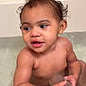 Royalty is registered to the contest to win money with this photo: baby, child, toddler, bathtub, bath, water, wet, wet_hair, sitting, face, portrait, indoor, bathroom, cup, container, bare_shoulders, curly_hair, looking_away, infant, candid