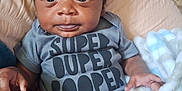 Josiah joined the competition — help win amazing prizes! baby, blanket, bodypart, clothing, couch, cushion, face, finger, furniture, hand, happy, head, homedecor, newborn, person, photography, portrait, sitting, smile, t_shirt