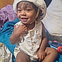Josiah joined the competition — help win amazing prizes! toddler, child, smiling, hat, sleeveless_shirt, indoor, blanket, pillow, toy, happy, cute, skin, foot, hand, face, sitting, wood_paneling, fabric, comfort, playful