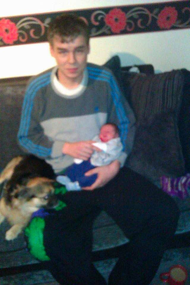 Mouse is registered to the contest to win money with this photo: child, comfort, cool, couch, elbow, electric_blue, event, facial_expression, finger, fun, human_leg, knee, lap, mammal, mouth, sitting, t_shirt, textile, thigh, trunk