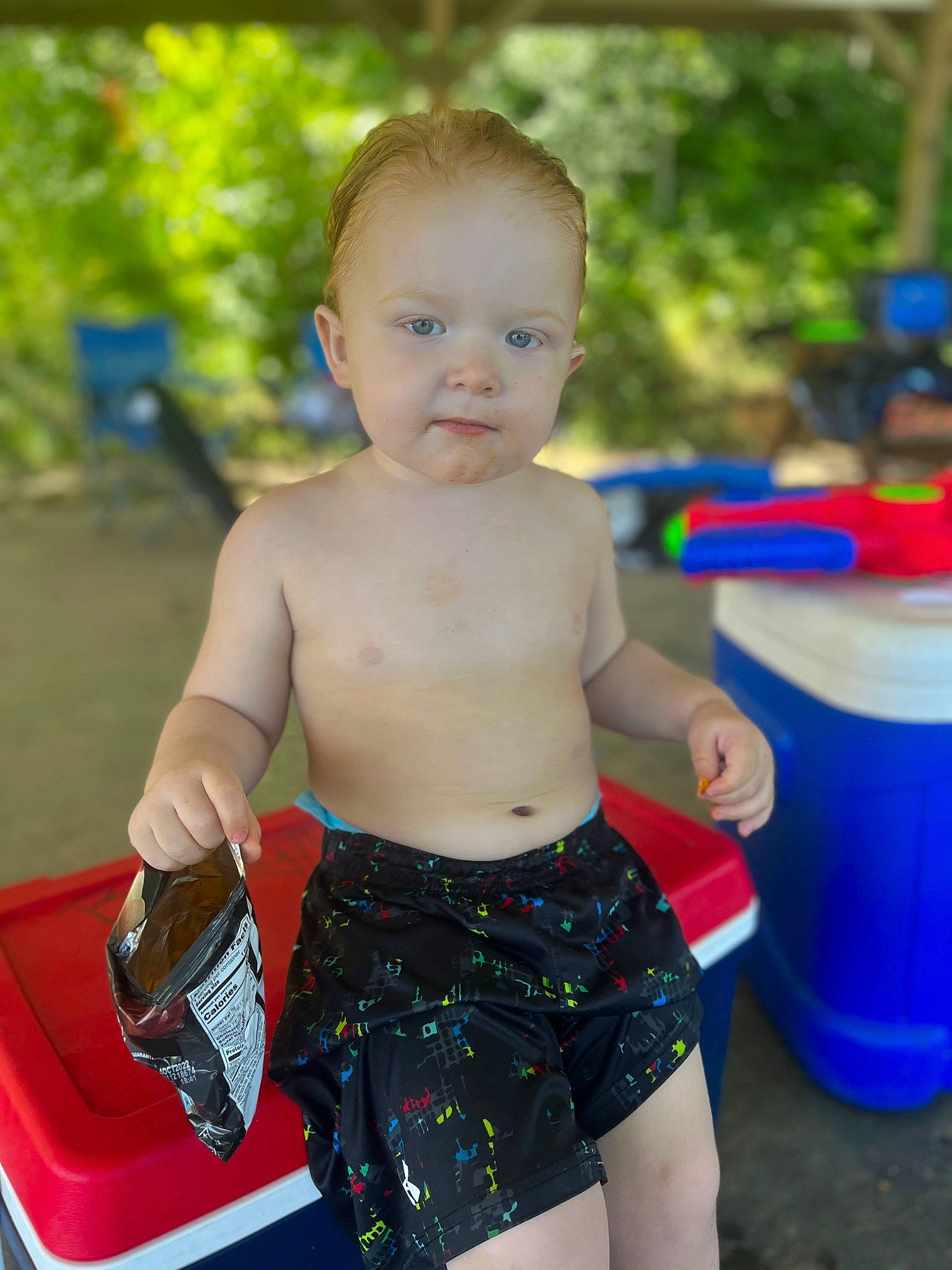 Joshua Ryan is registered to the contest to win money with this photo: abdomen, baby, baby_toddler_clothing, blue, chest, child, electric_blue, fun, grass, happy, human_leg, leisure, navel, person, recreation, swimwear, thigh, toddler, trunk, trunks