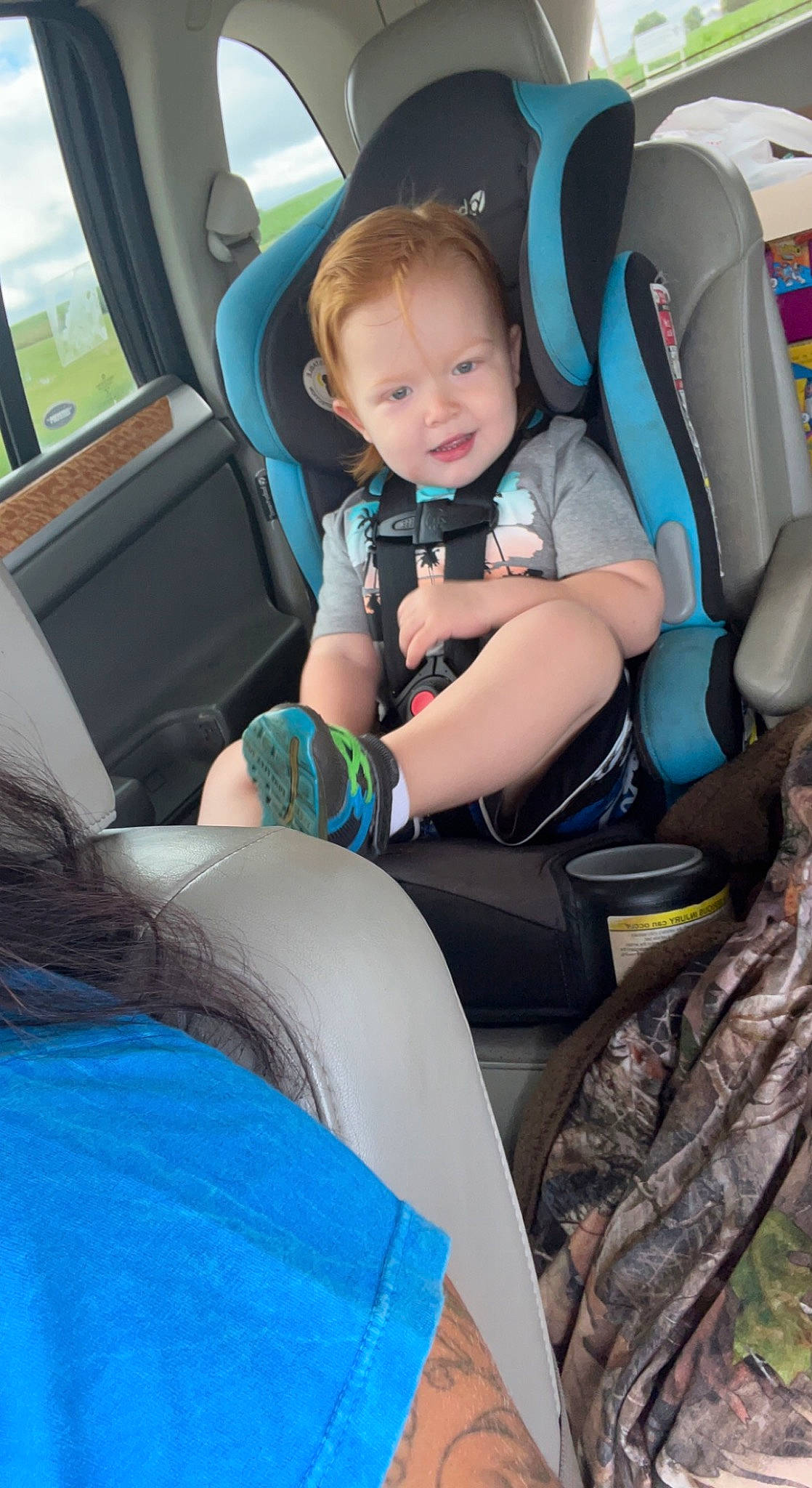 Joshua Ryan joined the competition — help win amazing prizes! auto_part, baby_in_car_seat, baby_toddler_clothing, blue, car, car_seat, car_seat_cover, child, comfort, electric_blue, fun, head_restraint, lap, leg, leisure, person, seat_belt, smile, steering_wheel, thigh