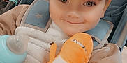 Corey joined the competition — help win amazing prizes! baby, baby_bottle, blanket, bottle, cap, child, childhood, clothing, comfort, cute, eyes, face, happy, indoor, plush_toy, portrait, seat, smiling, stroller, toy