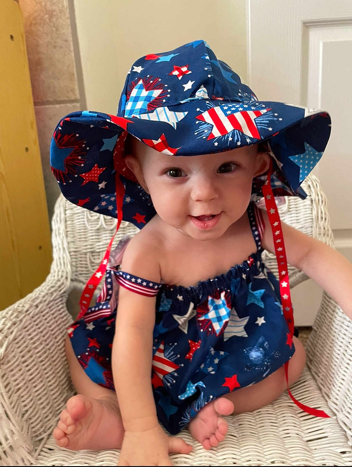 Winter joined the competition — help win amazing prizes! baby, child, hat, blue, red, white, stars, pattern, wicker_chair, smile, cute, indoors, clothing, face, barefoot, sitting, ribbon, happy, portrait, person