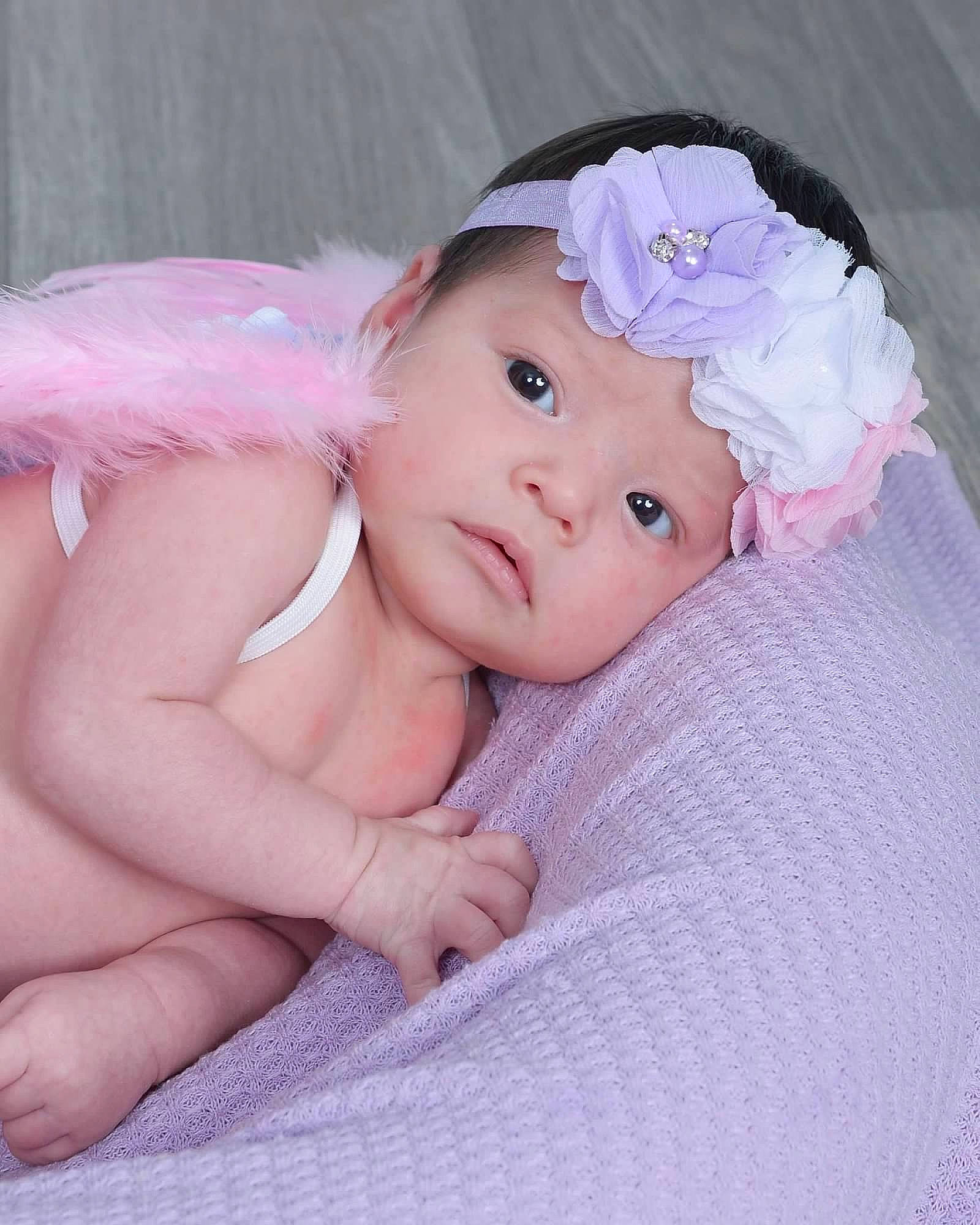 Eliana joined the competition — help win amazing prizes! baby, baby_toddler_clothing, cap, cheek, eye, eyebrow, finger, grass, hair_accessory, happy, headband, headgear, headpiece, headwear, iris, linens, lip, person, petal, pink