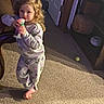 ball, barefoot, basket, bottle, carpet, casual, child, cozy, curly_blonde_hair, curly_hair, door, floor, furniture, home, indoor, pajamas, person, shelf, standing, toddler