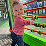 abacus, child, clothing, colorful, daylight, development, face, fun, hair, hand, happy, outdoor, pants, person, play, playground, shirt, smile, toddler, toy